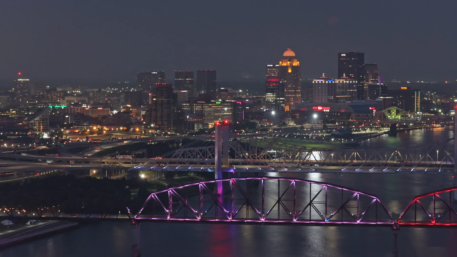 The Louisville skyline and the Big Four Bridge at night